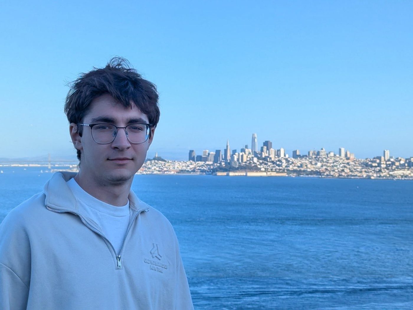 Andrii Drok with the San Francisco skyline across the bay behind him
